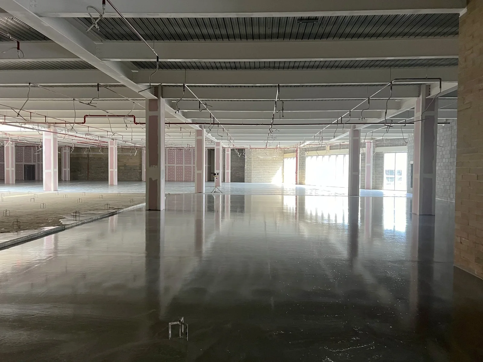 Large open commercial floor during screeding works in High Wycombe